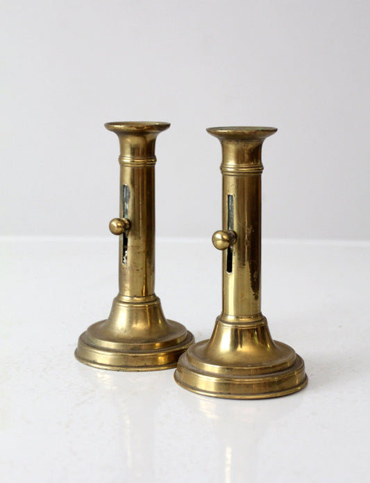 antique brass push-up candlestick holders pair